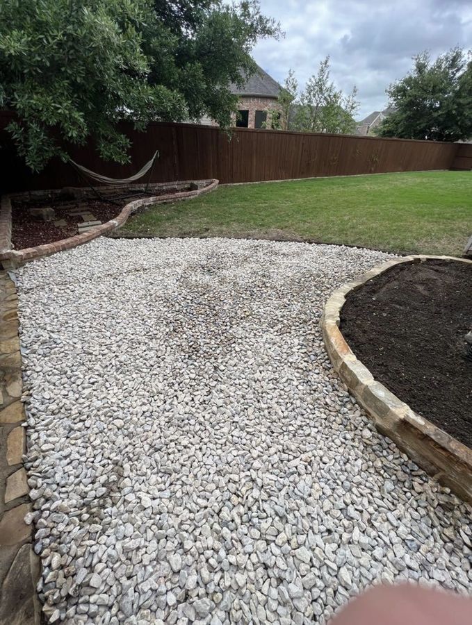 A side yard that stayed wet, fixed with gravel and stone in Allen — Wide gravel bed and planting border