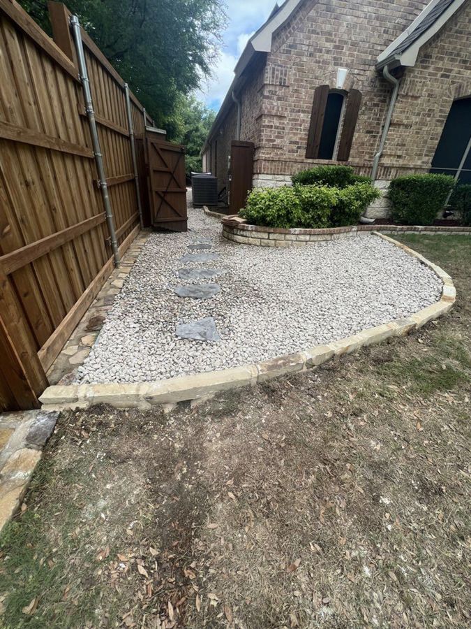 Gravel bed with cut-stone border and stepping stones in an Allen side yard