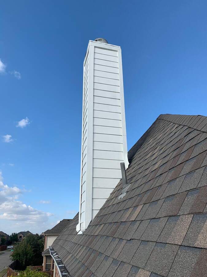 Tall chimney chase with new white trim