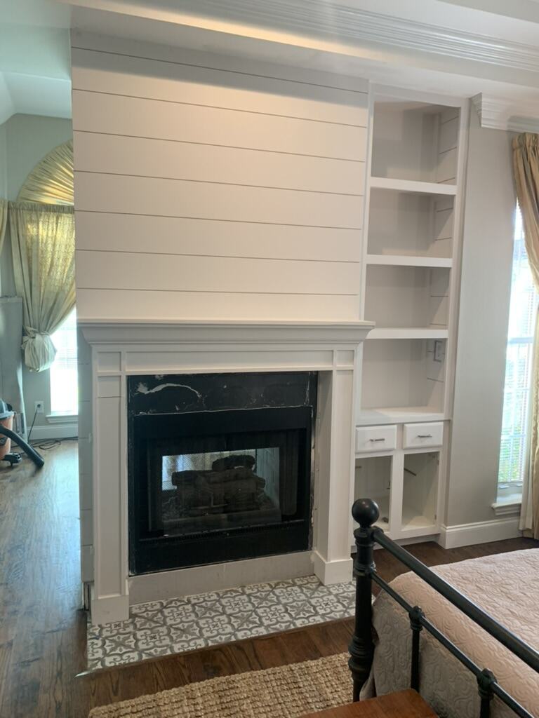 Shiplap fireplace with built-in shelving