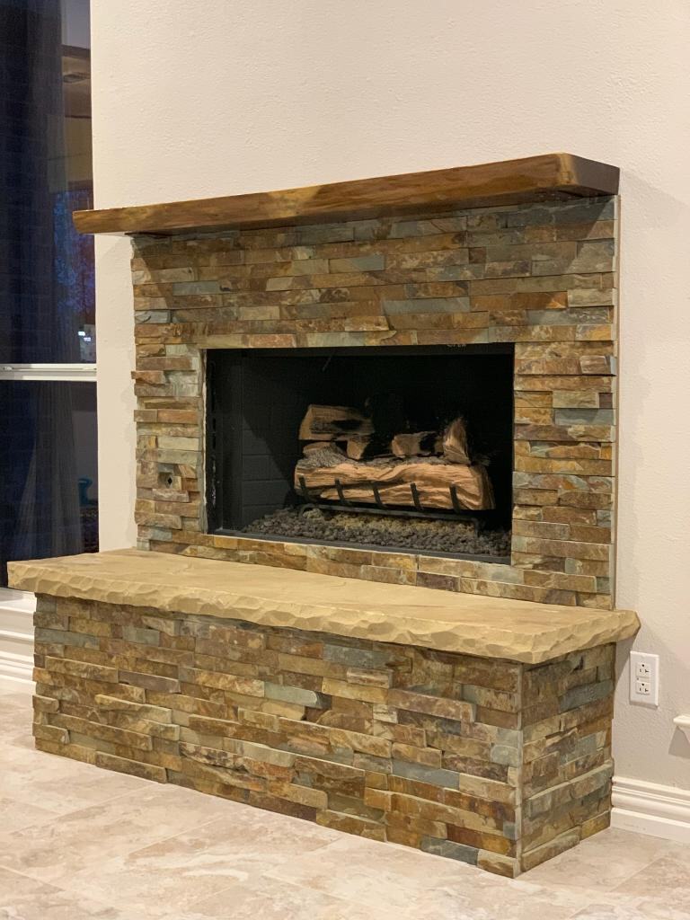 Stacked-stone fireplace with live-edge mantel