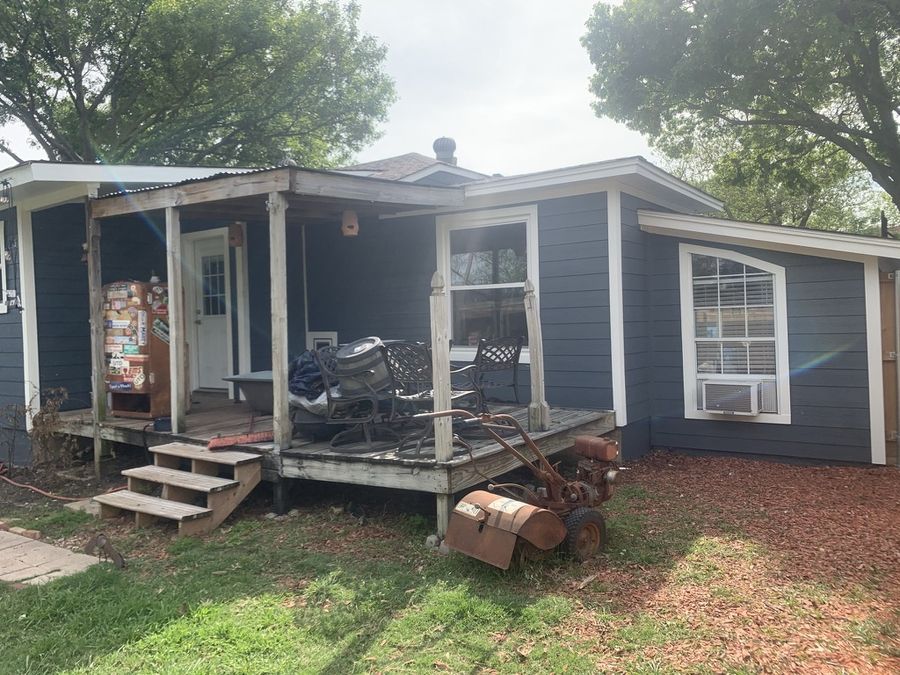 Whole-house re-side, cream to navy in Downtown Garland — After — porch side