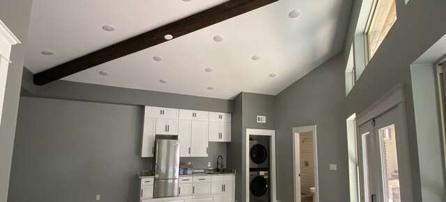 Remodeled casita interior with exposed beam and new kitchenette
