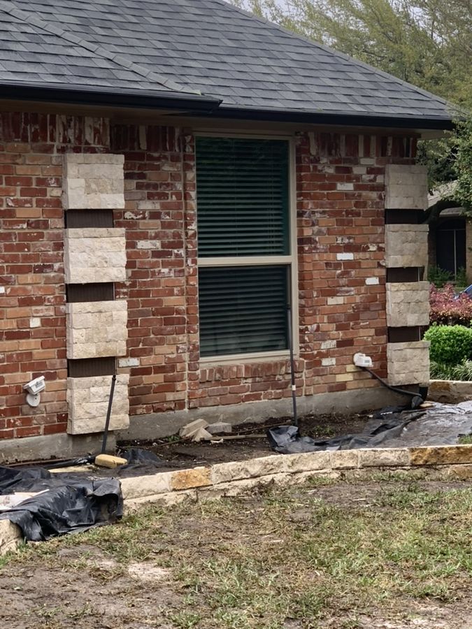 Stone accent columns and border added to a brick home