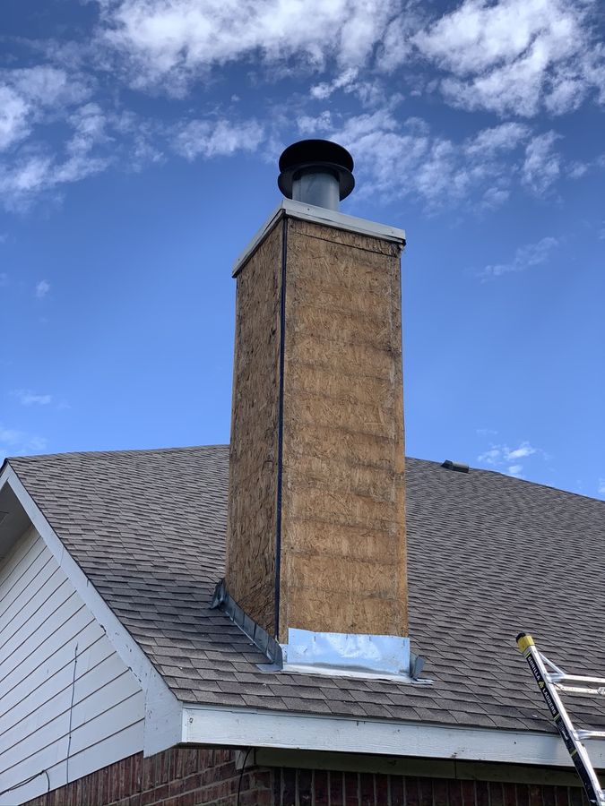 Two chimney chases stripped, re-sided and capped in Southlake — Before — chase down to bare sheathing